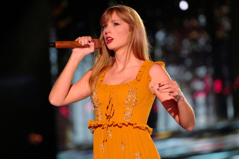 <p>Swift went for a whimsical look as she performed various songs from <a href="https://people.com/music/taylor-swift-evermore-album-review/" rel="nofollow noopener" target="_blank" data-ylk="slk:her album Evermore;elm:context_link;itc:0;sec:content-canvas" class="link ">her album <em>Evermore</em></a> in a yellow Etro dress that featured a corset top and beading detail down the front. For <a href="https://people.com/music/taylor-swift-releases-willow-music-video-new-album-evermore/" rel="nofollow noopener" target="_blank" data-ylk="slk:her bewitching performance of "Willow";elm:context_link;itc:0;sec:content-canvas" class="link ">her bewitching performance of "Willow"</a> she added a matching Etro cape. </p>