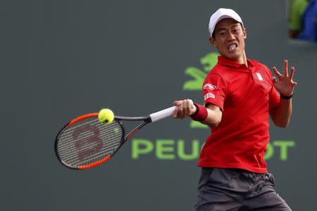 Mar 24, 2017; Miami, FL, USA; Kei Nishikori of Japan hits a forehand against Kevin Anderson of South Africa (not pictured) on day four of the 2017 Miami Open at Brandon Park Tennis Center. Nishikori won 6-4, 6-3. Geoff Burke-USA TODAY Sports