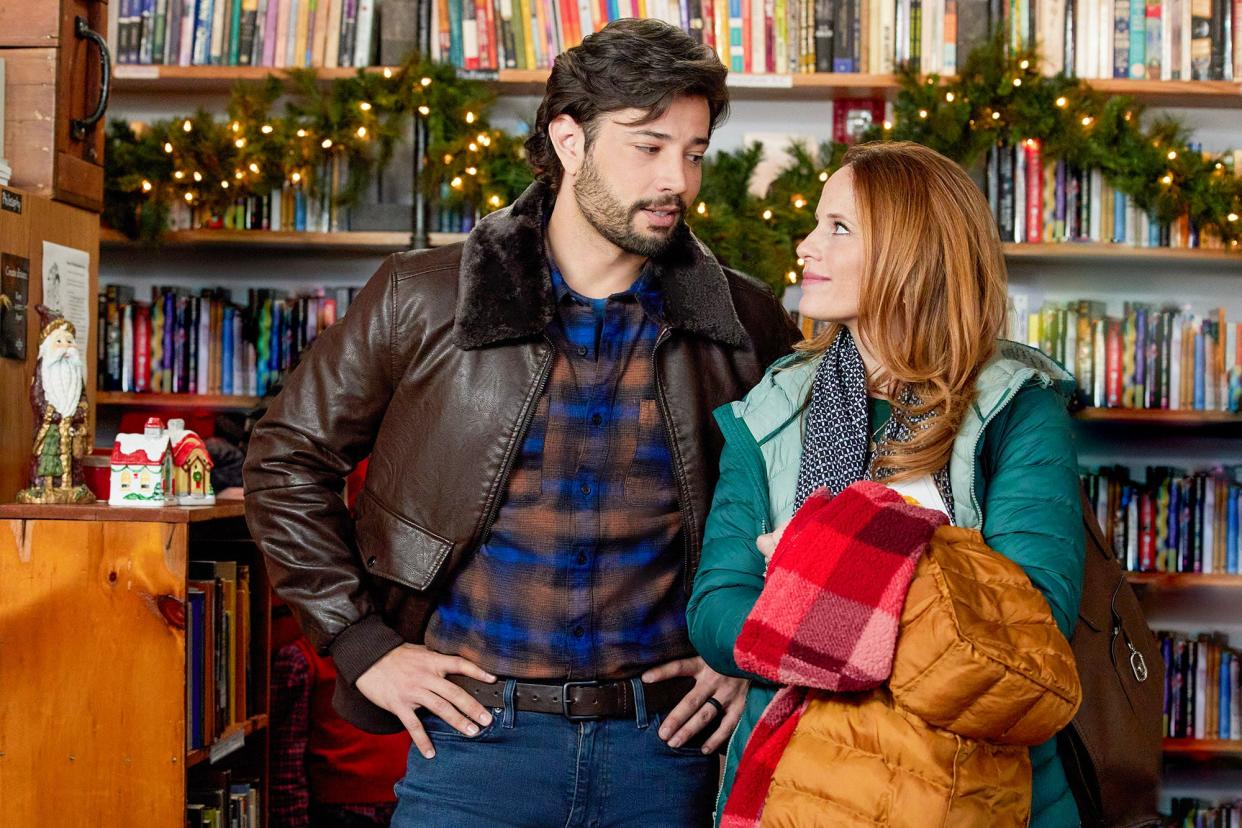 From left, Rafael de la Fuente and Katie Leclerc feel the magic of Christmas at Bedlam Book Café, 138 Green St., Worcester, in a scene from Hallmark Channel’s “Letters to Santa.”