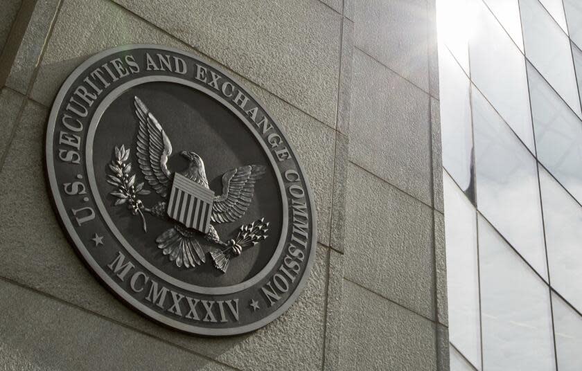 FILE - This June 19, 2015 file photo shows the seal of the U.S. Securities and Exchange Commission at SEC headquarters, in Washington. The Securities and Exchange Commission went after two prominent companies in the crypto community on Thursday, Jan. 12, 2023. (AP Photo/Andrew Harnik, File)