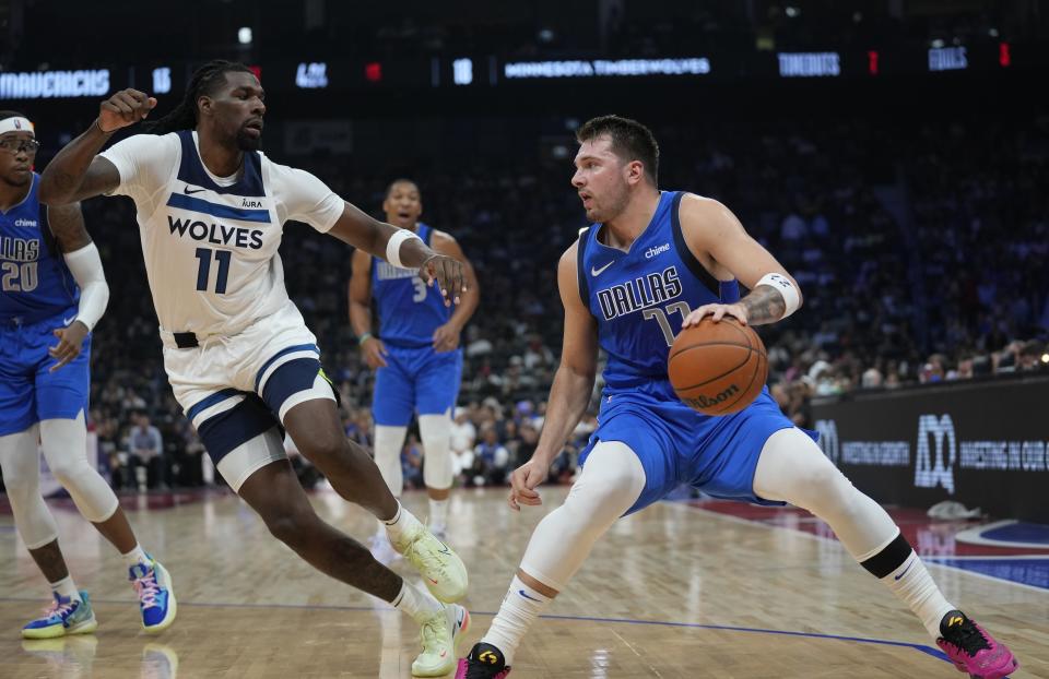 Dallas Mavericks' Luka Doncic drives during a preseason NBA basketball game between the Dallas Mavericks and Minnesota Timberwolves in Abu Dhabi, United Arab Emirates in Abu Dhabi, United Arab Emirates, Saturday, Oct. 7, 2023. (AP Photo/Kamran Jebreili)