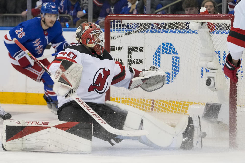 New York Rangers center Barclay Goodrow scores a goal past New Jersey Devils goaltender Akira Schmid (40) during the third period of an NHL hockey game, Saturday, April 29, 2023, at Madison Square Garden in New York. The Rangers won 5-2. (AP Photo/Mary Altaffer)