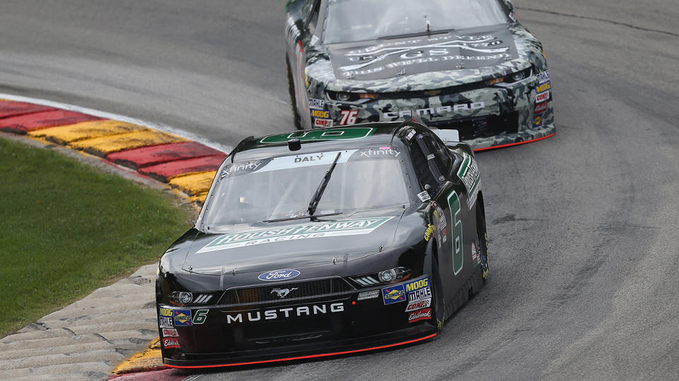 Conor Daly, driver of the #6 Roush Fenway Racing Ford, and Spencer Boyd, driver of the #76 Grunt Style Chevrolet. (Photo by Matt Sullivan/Getty Images)