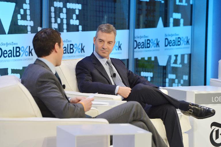 Third Point founder Daniel Loeb (R) participate in a discussion at a conference in New York. The US billionaire has dumped his stake in struggling Sony