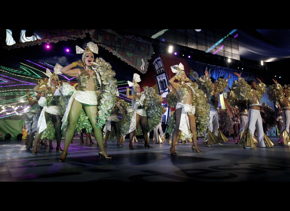 Tenerife carnival 'comparsa' dancers perform on the stage where the Queen of the Carnival of the Santa Cruz is elected, on the Spanish Canary island of Tenerife, February 15, 2012. (DESIREE MARTIN/AFP/Getty Images)