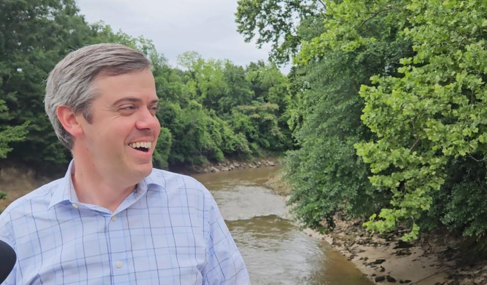 Hattiesburg Mayor Toby Barker talks about the grant that will help fund new trails along Gordon's Creek during a news conference Monday.