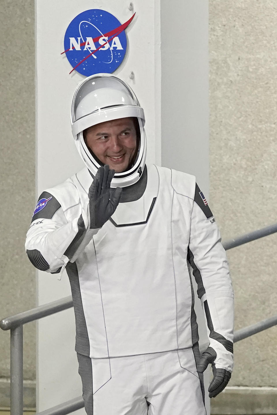 NASA astronaut Kjell Lindgren waves as he leaves the Operations and Checkout Building for a trip to Launch Complex 39-A Wednesday, April 27, 2022, at the Kennedy Space Center in Cape Canaveral, Fla. Four astronauts will fly on SpaceX's Crew-4 mission to the International Space Station. (AP Photo/John Raoux)