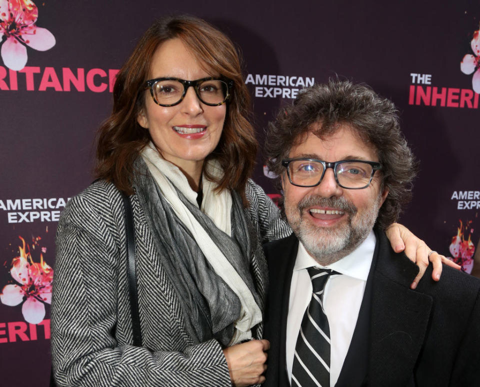 Tina Fey and Jeff Richmond posing on a red carpet