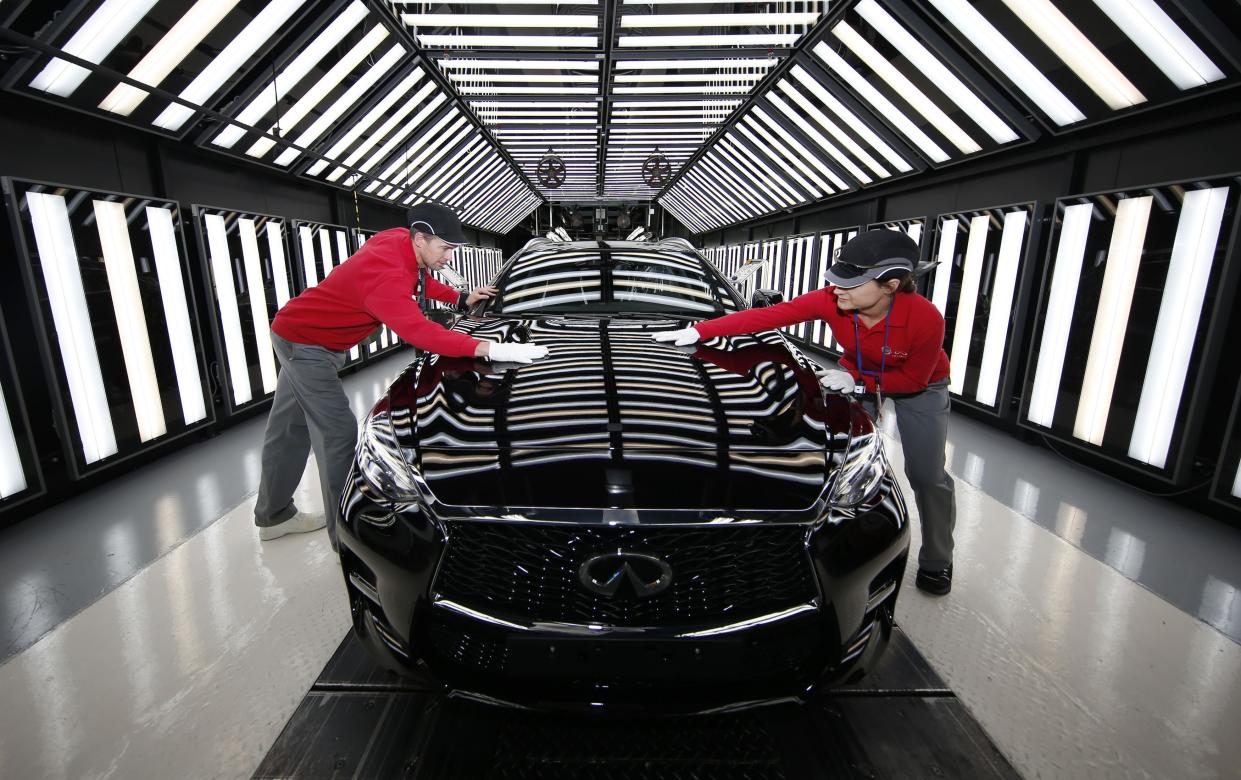 Workers at Nissan's plant in Sunderland on the production line for the Infiniti Q30 &quot;active compact&quot; vehicle, the first major new brand of car to be manufactured in Britain for 23 years.