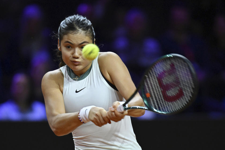 Britain's Emma Raducanu plays Poland's Iga Swiatek during her quarterfinals tennis match at the WTA Tour in Stuttgart, Germany, Friday April 19, 2024. (Marijan Murat/dpa via AP)