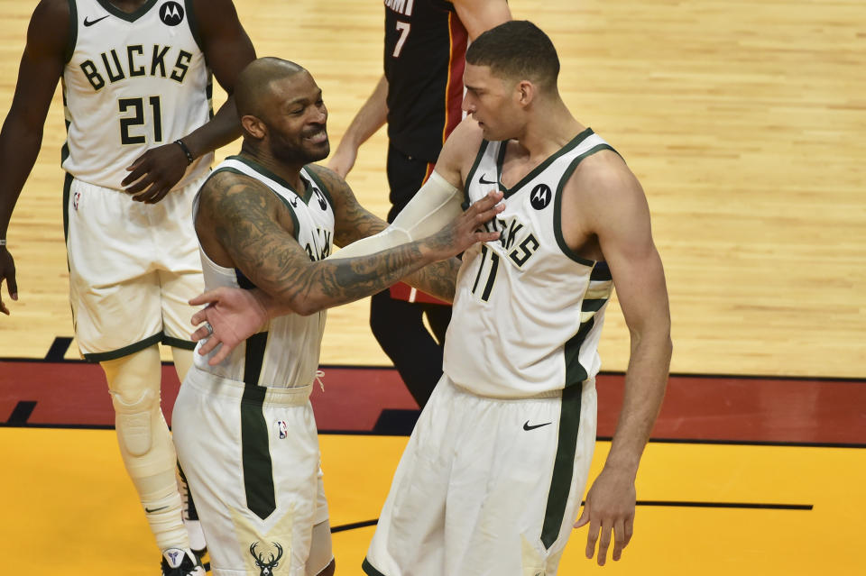  P.J. Tucker #17 of the Milwaukee Bucks celebrates with Brook Lopez #11 during the fourth quarter against the Miami Heat in Game Four of the Eastern Conference first-round playoff series at American Airlines Arena on May 29, 2021 in Miami, Florida. (NOTE TO USER: User expressly acknowledges and agrees that, by downloading and or using this photograph,  User is consenting to the terms and conditions of the Getty Images License Agreement.(Photo by Eric Espada/Getty Images)