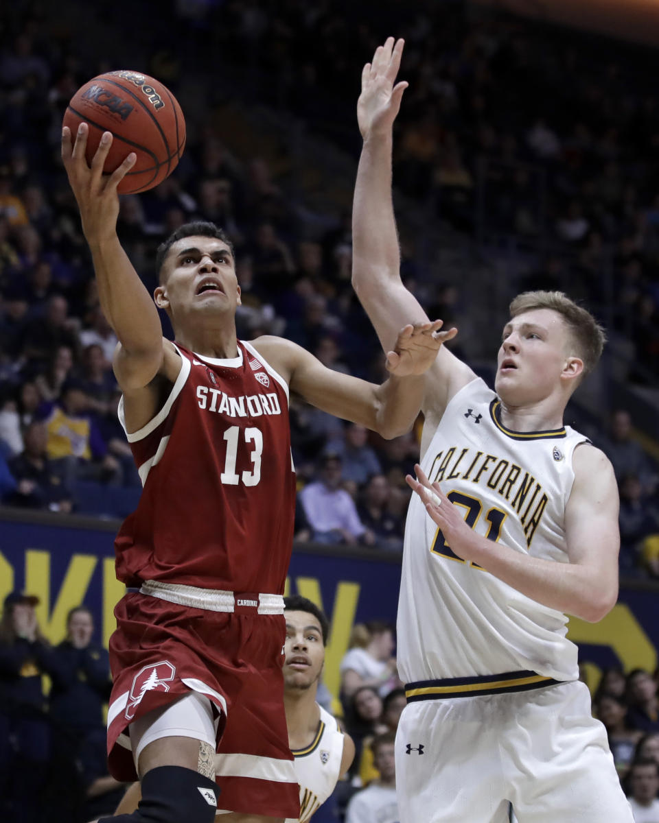 Stanford's Oscar da Silva (13) lays up a shot past California's Lars Thiemann, right, in the first half of an NCAA college basketball game Sunday, Jan. 26, 2020, in Berkeley, Calif. (AP Photo/Ben Margot)