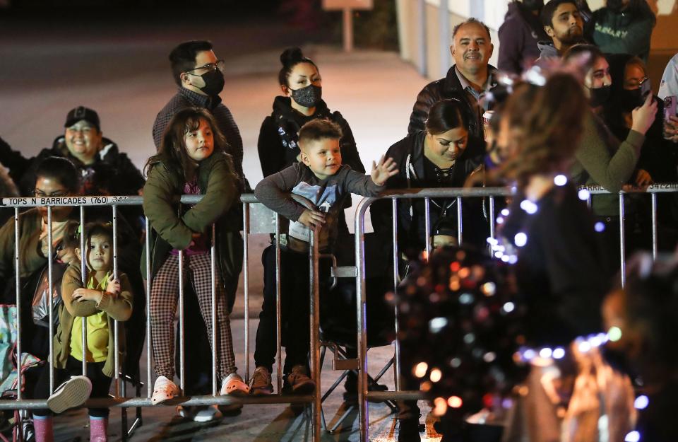 Spectators watch the Coachella Holiday Parade, December 10, 2021.