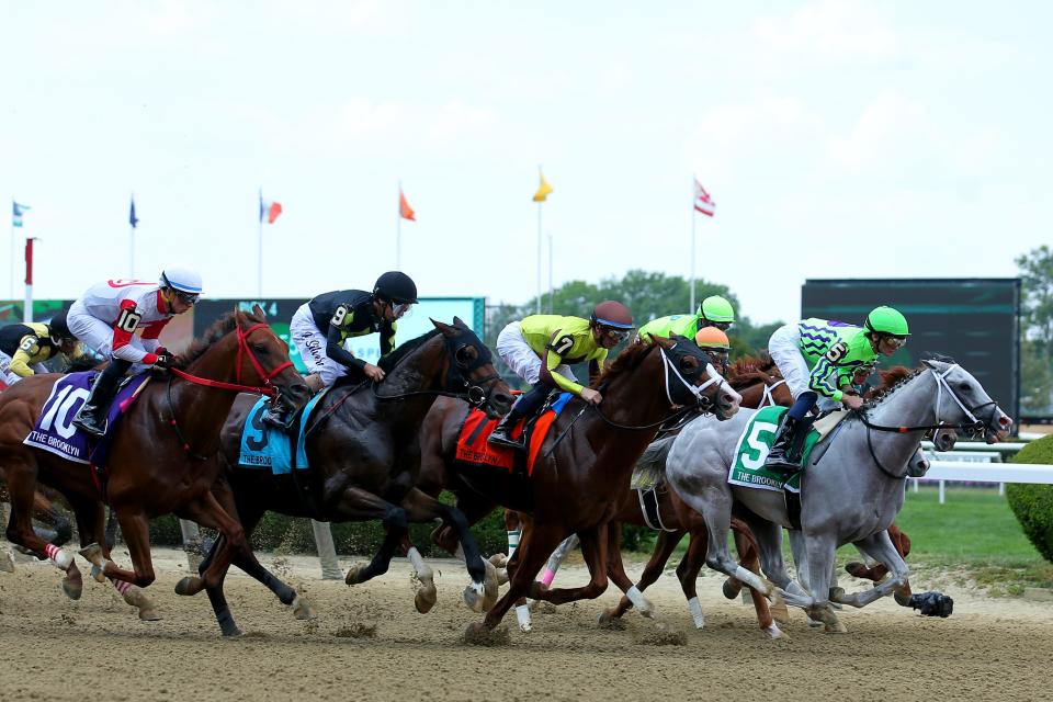 Jun 10, 2023; Elmont, New York, USA; Next (5) with jockey Luan Machado up leads the pack out of the gate in the 134th running of the Brooklyn at Belmont Park.