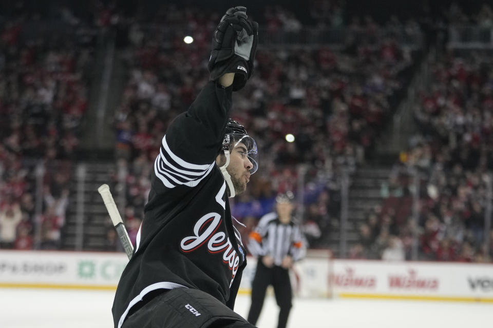 New Jersey Devils center Nico Hischier celebrates after scoring against the Carolina Hurricanes during the second period of an NHL hockey game, Saturday, March 9, 2024, in Newark, N.J. (AP Photo/Mary Altaffer)