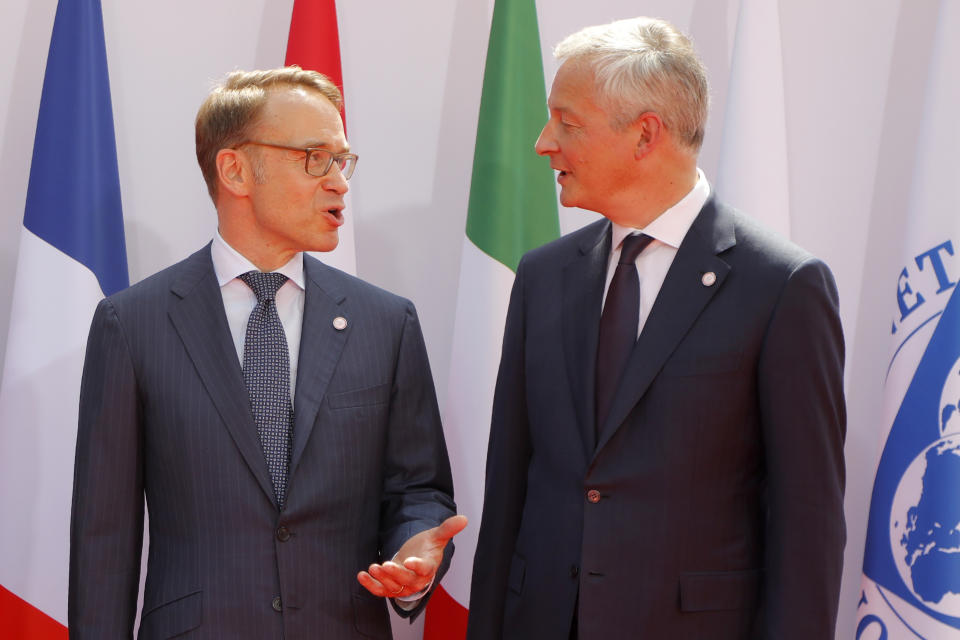 French Finance Minister Bruno Le Maire, right, welcomes German Bundesbank President Jens Weidmann at the G-7 Finance Wednesday July 17, 2019 in Chantilly, north of Paris. The Group of Seven rich democracies' top finance officials gathered Wednesday at a chateau near Paris in search of common ground on the threats posed by digital currencies. (AP Photo/Michel Euler)