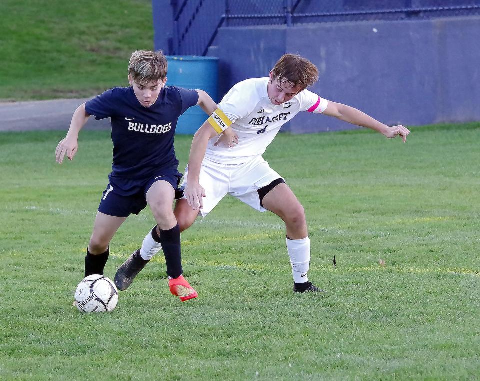 Cohasset and Rockland scrapped for every ball throughout the entire game. Here Rockland's Kaiky Araujo fights Cohasset's Andrew Buckley for control of the ball in the Cohasset territory in the second half of the soccer game on Monday, Oct. 31, 2022.