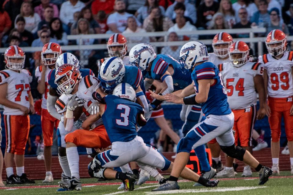 Lakewood's Xander Angle (3) helps tackle Heath's Conner Toomey during a Week 6 game. Angle missed the first half of the Lancers' season with a knee injury.