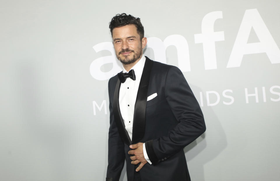 Orlando Bloom poses for photographers upon arrival at the amfAR Cinema Against AIDS benefit the during the 74th Cannes international film festival, Cap d'Antibes, southern France, Friday, July 16, 2021. (Photo by Vianney Le Caer/Invision/AP)