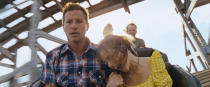 This image released by A24 Films shows Simon Rex, left, and Suzanna Son in a scene from "Red Rocket." (A24 via AP)