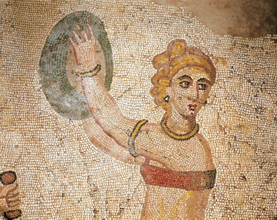 An Italian mosaic of a woman at a gym in a bra