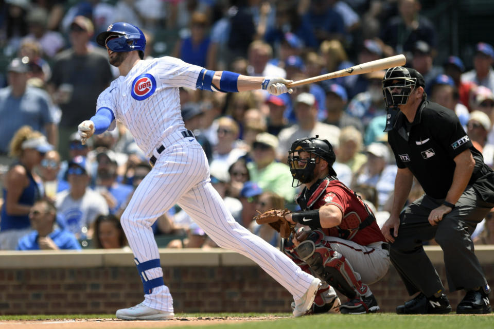 Chicago Cubs' Kris Bryant watches his two-run home run during the first inning of a baseball game against the Arizona Diamondbacks Sunday, July 25, 2021, in Chicago. (AP Photo/Paul Beaty)