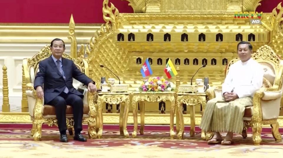 In this image taken from video broadcast by Myanmar state broadcaster MRTV, Cambodian Prime Minister Hun Sen, left, and Myanmar State Administration Council Chairman, Senior General Min Aung Hlaing hold a meeting in Naypyitaw, Myanmar, Friday Jan. 7, 2022. Cambodian Prime Minister Hun Sen’s visit to Myanmar seeking to revive peace efforts after last year's military takeover has provoked an angry backlash among critics, who say he is legitimizing the army’s seizure of power. (MRTV via AP)