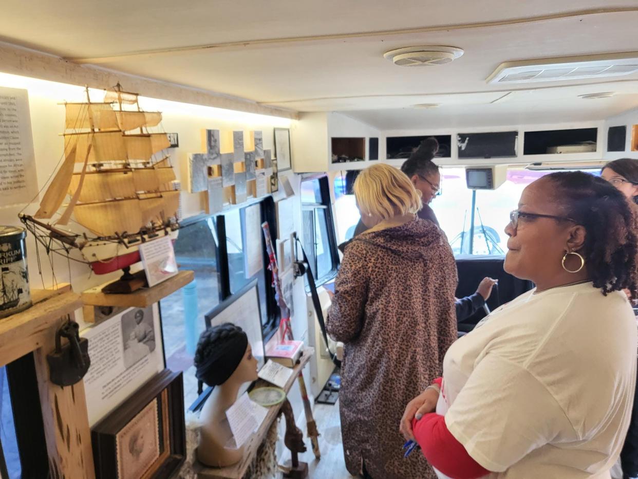 Karen Wolfe, right, looks at the exhibits in the new Finding Our Roots African American History Museum's RV, which visited Houma's Main Libary on Wednesday, Feb. 1, 2023.