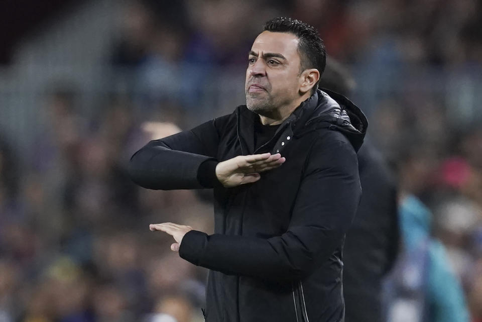 Barcelona's head coach Xavi Hernandez reacts during the Spanish La Liga soccer match between Barcelona and Real Madrid at Camp Nou stadium in Barcelona, Spain, Sunday, March 19, 2023. (AP Photo/Joan Mateu)