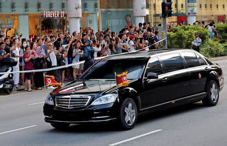 FILE PHOTO: The vehicle carrying North Korean leader Kim Jong Un makes its way to the Istana, ahead of the summit between the North Korean leader and U.S. President Donald Trump, in Singapore June 10, 2018. REUTERS/Tyrone Siu/Files