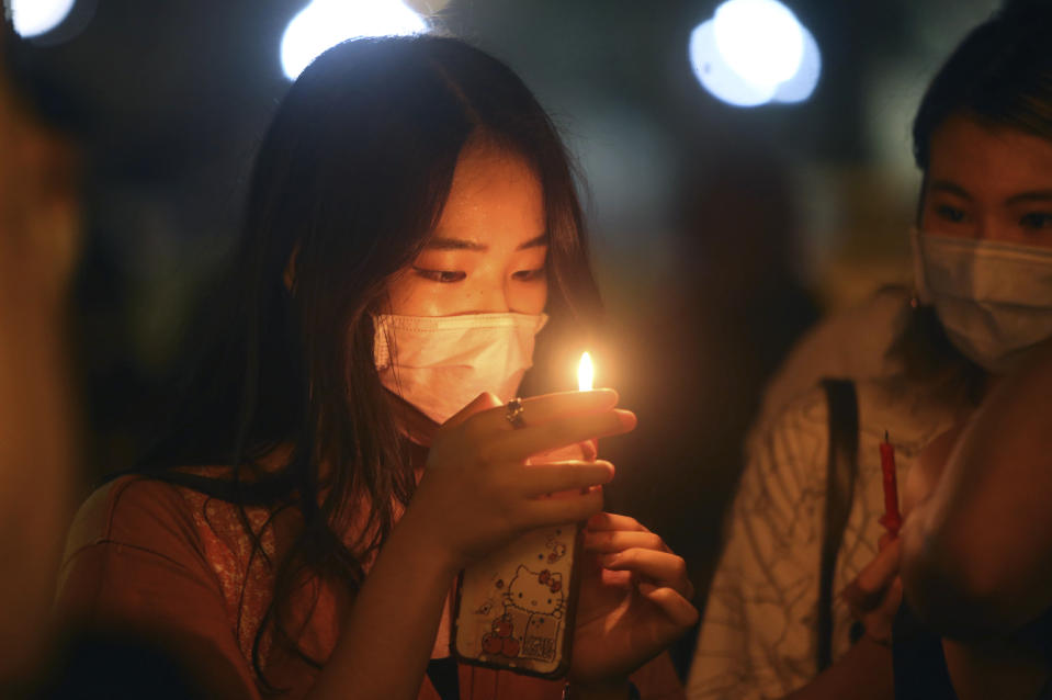 Hundreds of participants attend a candlelight vigil at Democracy Square in Taipei, Taiwan, Thursday, June 4, 2020, to mark the 31st anniversary of the Chinese military crackdown on the pro-democracy movement in Beijing's Tiananmen Square. (AP Photo/Chiang Ying-ying)