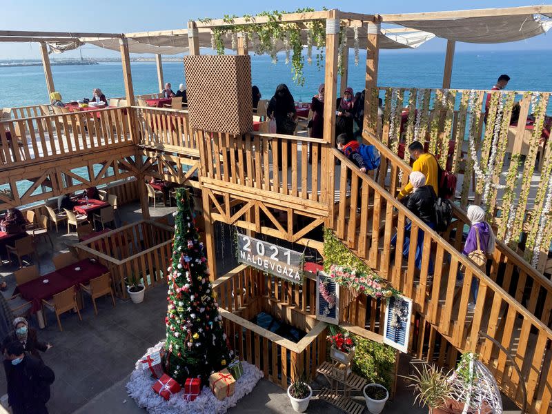 A Christmas tree is seen at the "Maldive Gaza" cafe on a beach in Gaza City