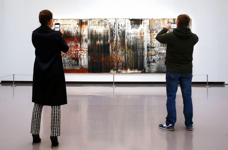 People take pictures of the painting "St. Gallen" by German painter Gerhard Richter at the Kunsthaus Zurich art museum in Zurich