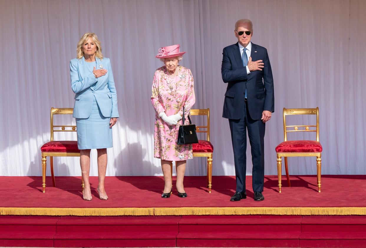 Queen Elizabeth II stands with US President Joe Biden and First Lady Jill Biden during their visit to Windsor Castle on 13 June 2021 in Windsor, England (Getty Images)