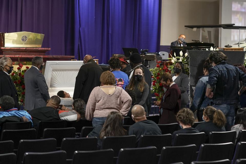 Family members pay their respects during a visitation for Daunte Wright Wednesday, April 21, 2021, in Minneapolis. Daunte Wright was fatally shot by a police officer during a traffic stop. (AP Photo/Morry Gash)