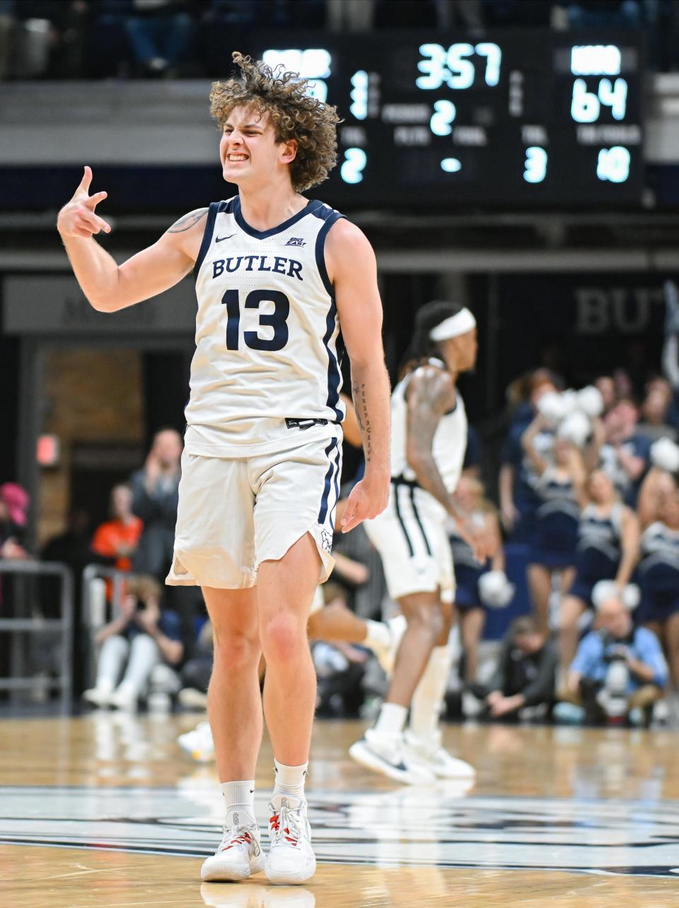 Butler Bulldogs guard Finley Bizjack (13) celebrates after making a three-point basket against the Marquette Golden Eagles during the second half at Hinkle Fieldhouse.