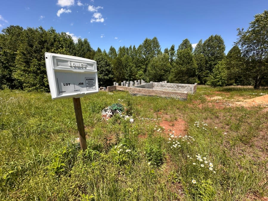 Building permits were pulled for this lot in April 2023 and the foundation is as far as this build progressed before construction stopped.