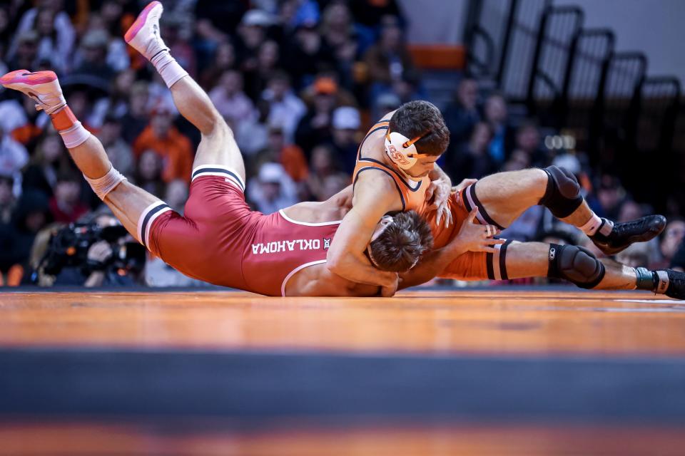Oklahoma State’s Reece Witcraft throws Oklahoma’s Joey Prata during a college wrestling meet between the Oklahoma State Cowboys (OSU) and the Oklahoma Sooners at Gallagher-Iba Arena in Stillwater, Okla., Thursday, Feb. 16, 2023.
