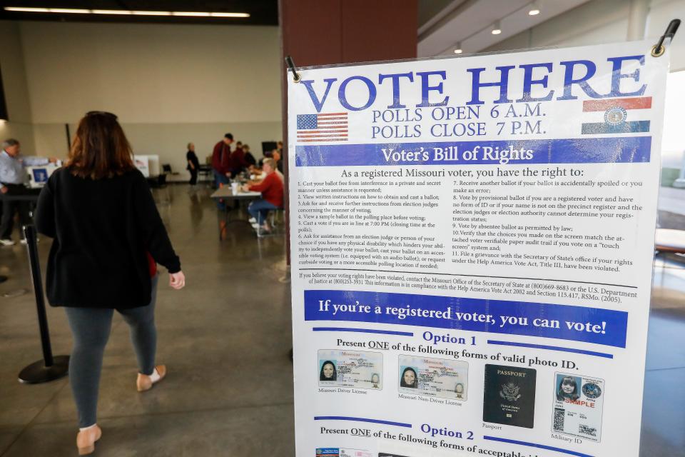 People walk in to vote at the Davis-Harrington Welcome Center at Missouri State University on Tuesday, April 2, 2019.