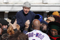 Former Illinois Gov. Rod Blagojevich acknowledges Chicago Cubs' fan Ronnie Woo Woo after a news conference outside his home Wednesday, Feb. 19, 2020, in Chicago. On Tuesday, President Donald Trump commuted Blagojevich's 14-year prison sentence for political corruption. (AP Photo/Charles Rex Arbogast)