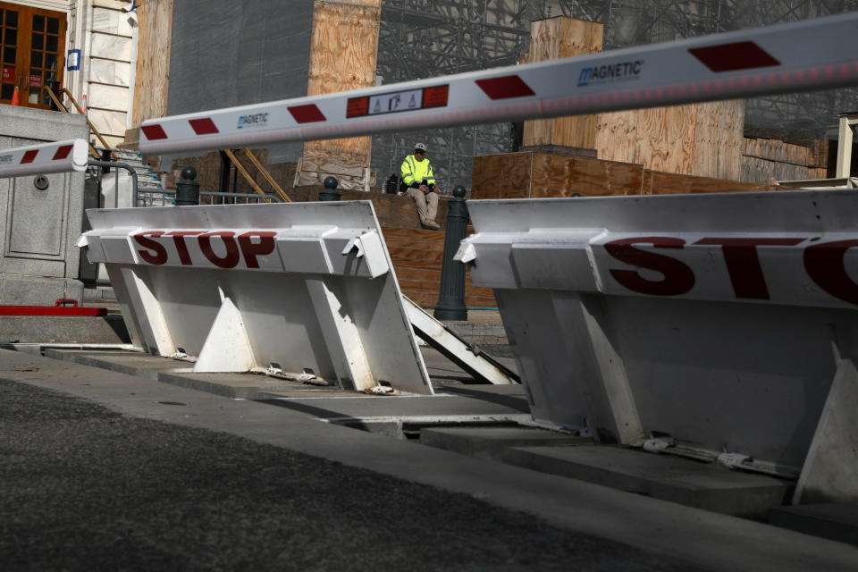 A construction worker sits for a break, in Washington, U.S. March 15, 2022. REUTERS/Emily Elconin