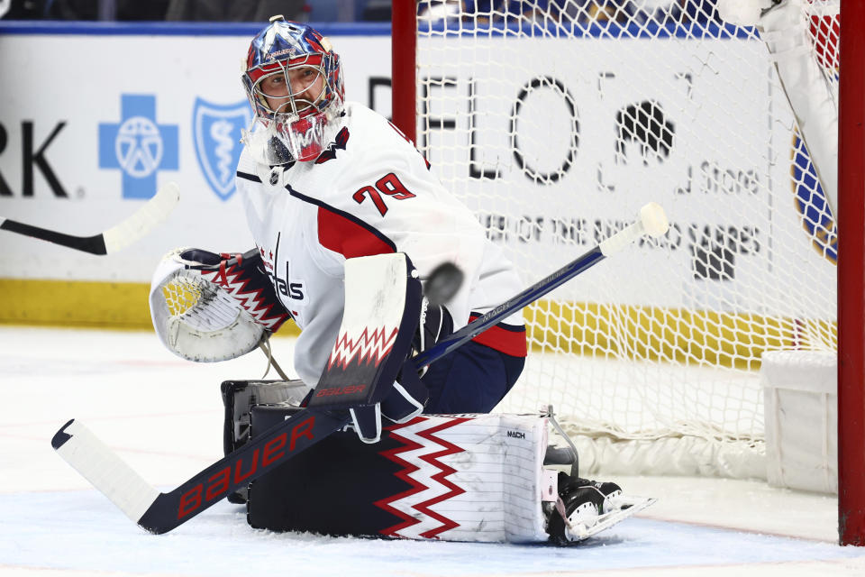 Washington Capitals goaltender Charlie Lindgren (79) watches the puck go wide during the first period of an NHL hockey game against the Buffalo Sabres, Thursday, April 11, 2024, in Buffalo, N.Y. (AP Photo/Jeffrey T. Barnes)