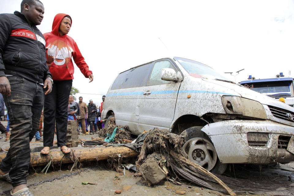 Resident are seen standing in the town of Katesh, in Tanzania, Sunday, Dec 3, 2023. At least 40 people have been killed and 80 others injured in landslides caused by flooding in northern Tanzania, a local official has said, with warnings the toll would rise.(AP Photo).