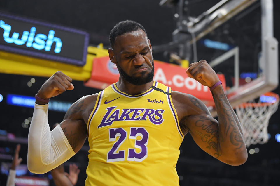 Los Angeles Lakers forward LeBron James gestures after scoring and drawing a foul during the first half of the team's NBA basketball game against the New York Knicks on Tuesday, Jan. 7, 2020, in Los Angeles. (AP Photo/Mark J. Terrill)