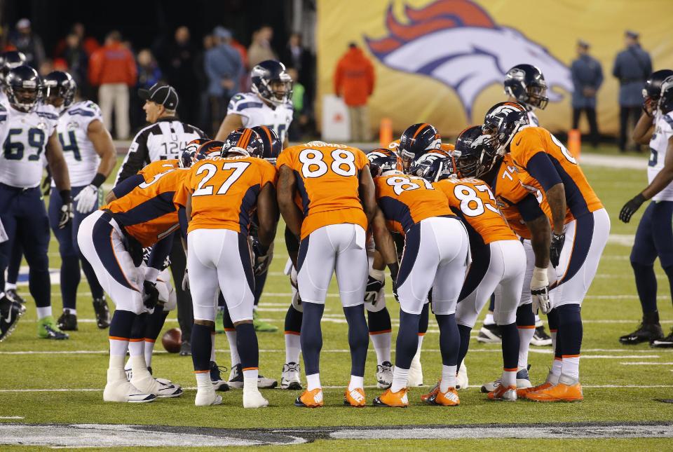 The Denver Broncos offense huddles during the first half of the NFL Super Bowl XLVIII football game against the Seattle Seahawks Sunday, Feb. 2, 2014, in East Rutherford, N.J. (AP Photo/Matt York)