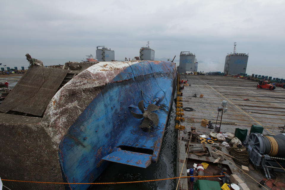 The sunken ferry Sewol sits on a semi-submersible ship