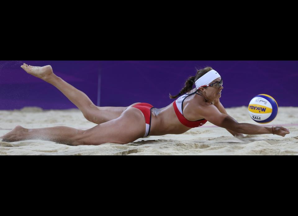 United States' Misty May-Treanor dives for a ball during the women's gold medal beach volleyball match against the other US team at the 2012 Summer Olympics, Wednesday, Aug. 8, 2012, in London. 