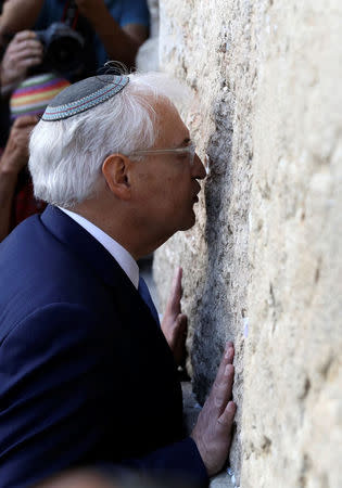 David Friedman, new United States Ambassador to Israel, kisses the Western Wall after arriving in the Jewish state on Monday and immediately paying a visit to the main Jewish holy site, in Jerusalem's Old City May 15, 2017 REUTERS/Ammar Awad