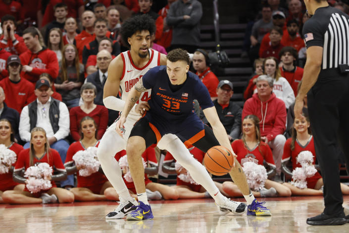Illinois' Coleman Hawkins, right, posts up against Ohio State's Justice Sueing during the second half of an NCAA college basketball game Sunday, Feb. 26, 2023, in Columbus, Ohio. (AP Photo/Jay LaPrete)