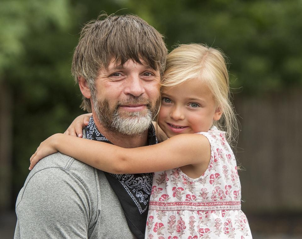 Jonnie Coutu of Princeton, shown with daughter Hadley in 2020, broke 4 hours in the marathon, at an event in Corning, New York.